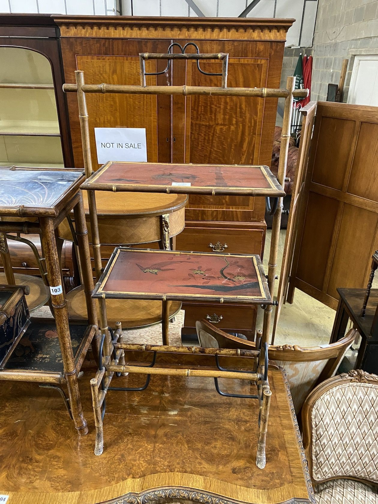 A Victorian three tier lacquer whatnot, with simulated bamboo uprights and a Victorian bamboo two tier table, with folding flaps and a lacquer and bamboo three tier table, largest height 103cm